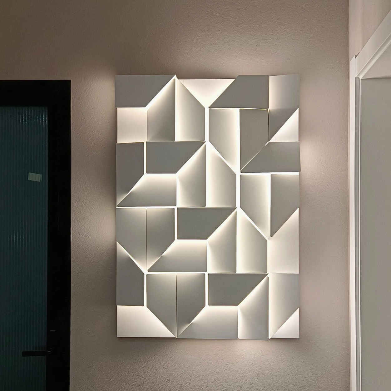 Abstract geometric wall lamp with white finish, integrated LED warm light illumination