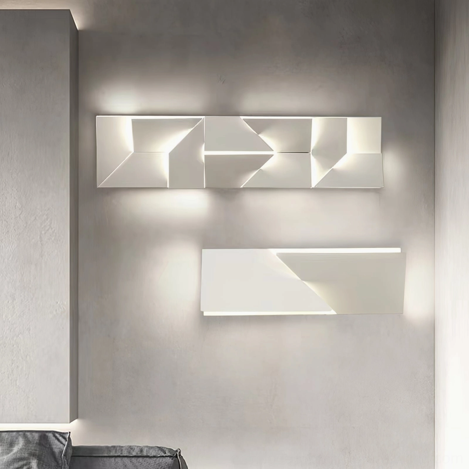 Dual rectangular geometric wall sconces with warm backlighting, minimalist modern wall installation