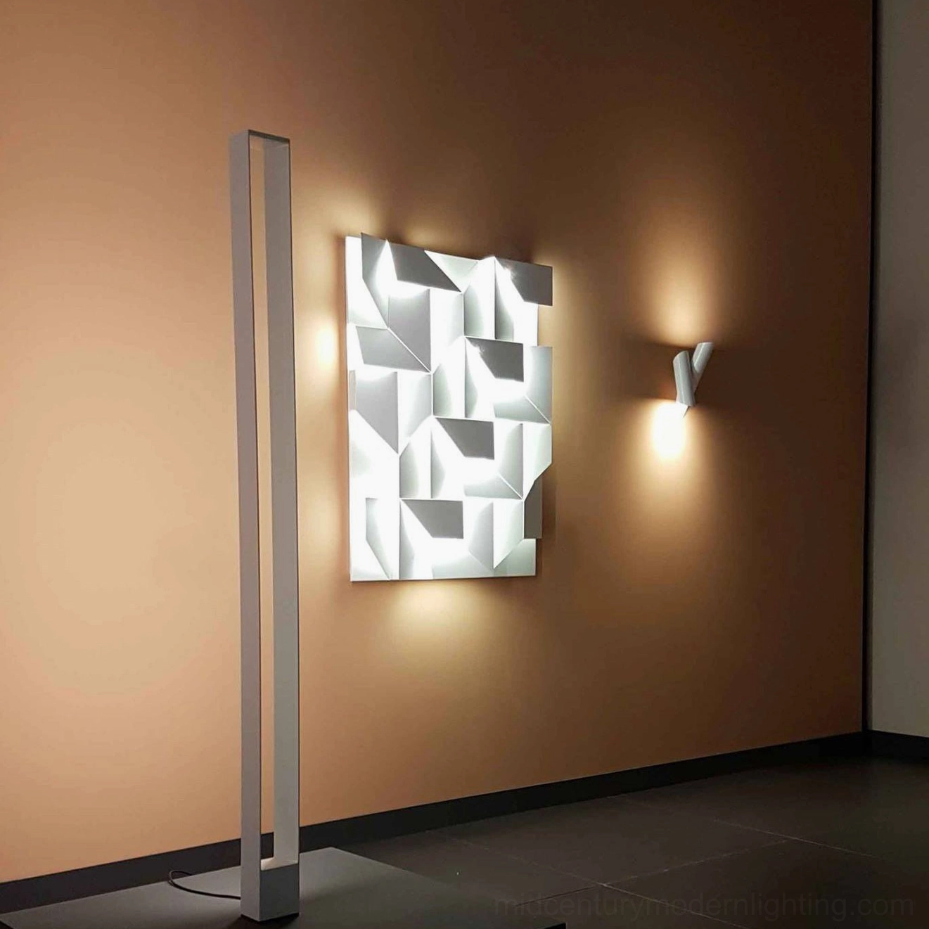 Shadows geometric wall lamp with abstract laser-cut pattern, LED backlit illumination