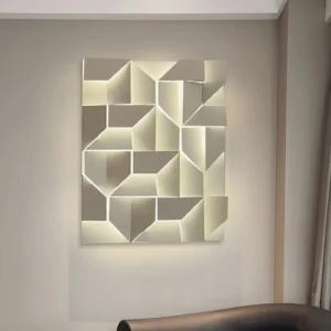 Modern geometric wall lamp installed in contemporary living room with gray tones and warm backlit illumination
