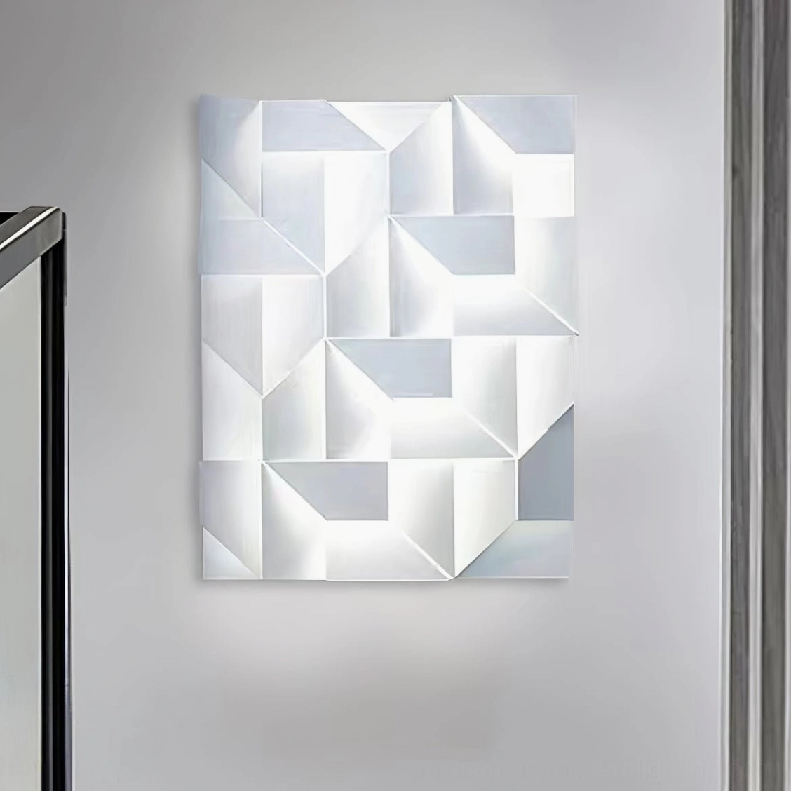 Shadows wall sconce in contemporary hallway entryway with white matte finish and subtle geometric pattern