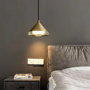 Shear pendant lamp installed overhead in modern bedroom, warm brass lighting ambiance luxury decor