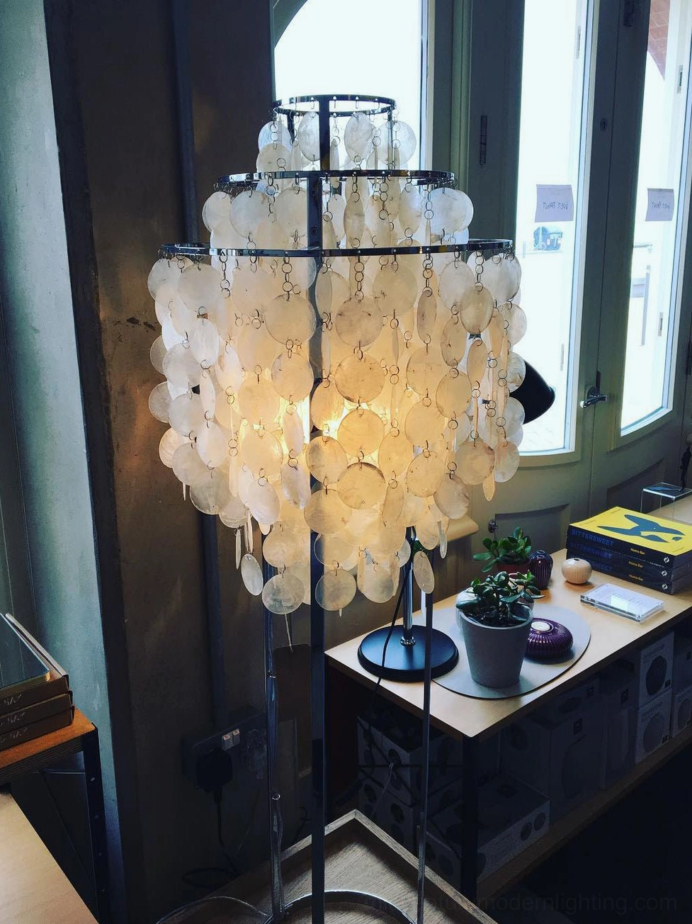 Shell floor lamp lighting functionality demonstration with warm glow effect