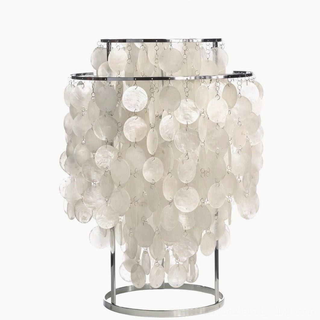 Contemporary shell table lamp with chrome finish in minimalist modern interior