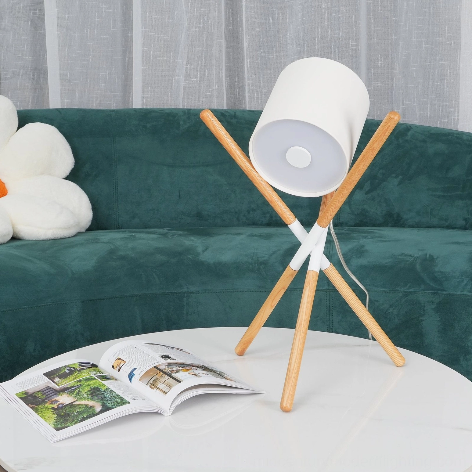 Mid-century modern tripod table lamp featuring natural wood construction and fabric lamp shade