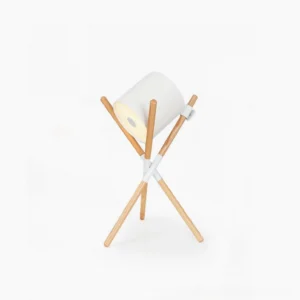 Shift mid-century modern tripod table lamp with natural wood legs and white fabric shade on white background