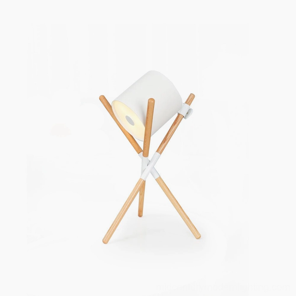 Shift mid-century modern tripod table lamp with natural wood legs and white fabric shade on white background