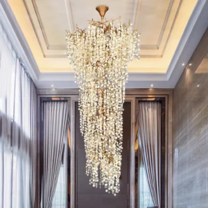 Shiro Noda chandelier installed in luxury residential lobby with floor-to-ceiling windows and dramatic vertical lighting
