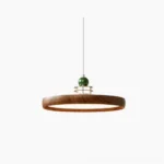 Sia Scalloped Saucer Pendant Light with walnut wood finish in studio view
