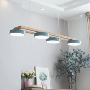 Blue-grey Sienna Bird Linear Chandelier installed above dining table in modern minimalist interior