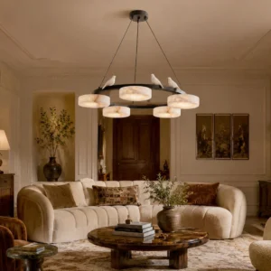 Sienna Bird chandelier installed in warm beige modern living room, casting soft diffused light through alabaster shades