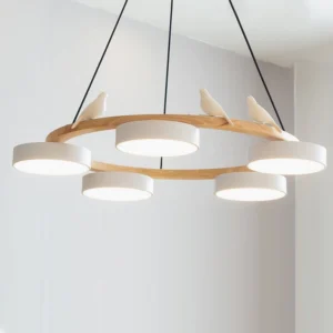 Sienna bird round pendant light from side angle showing wood frame, white frosted acrylic diffusers, and adjustable black suspension wire, minimalist interior