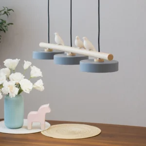 Sienna bird pendant fixture hanging above dining table with warm Nordic home decor styling