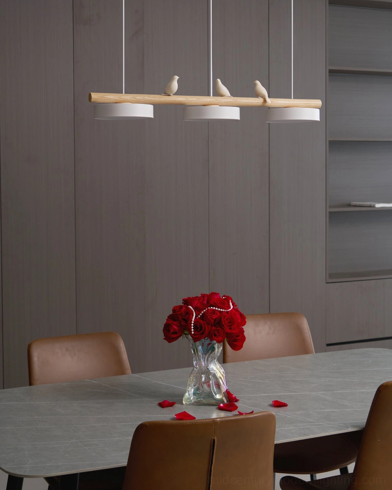 Sienna pendant lamp with dynamic bird composition in modern dining room setting