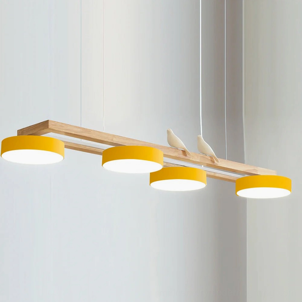 Sienna Bird Linear Chandelier yellow finish variant in Scandinavian modern dining setting