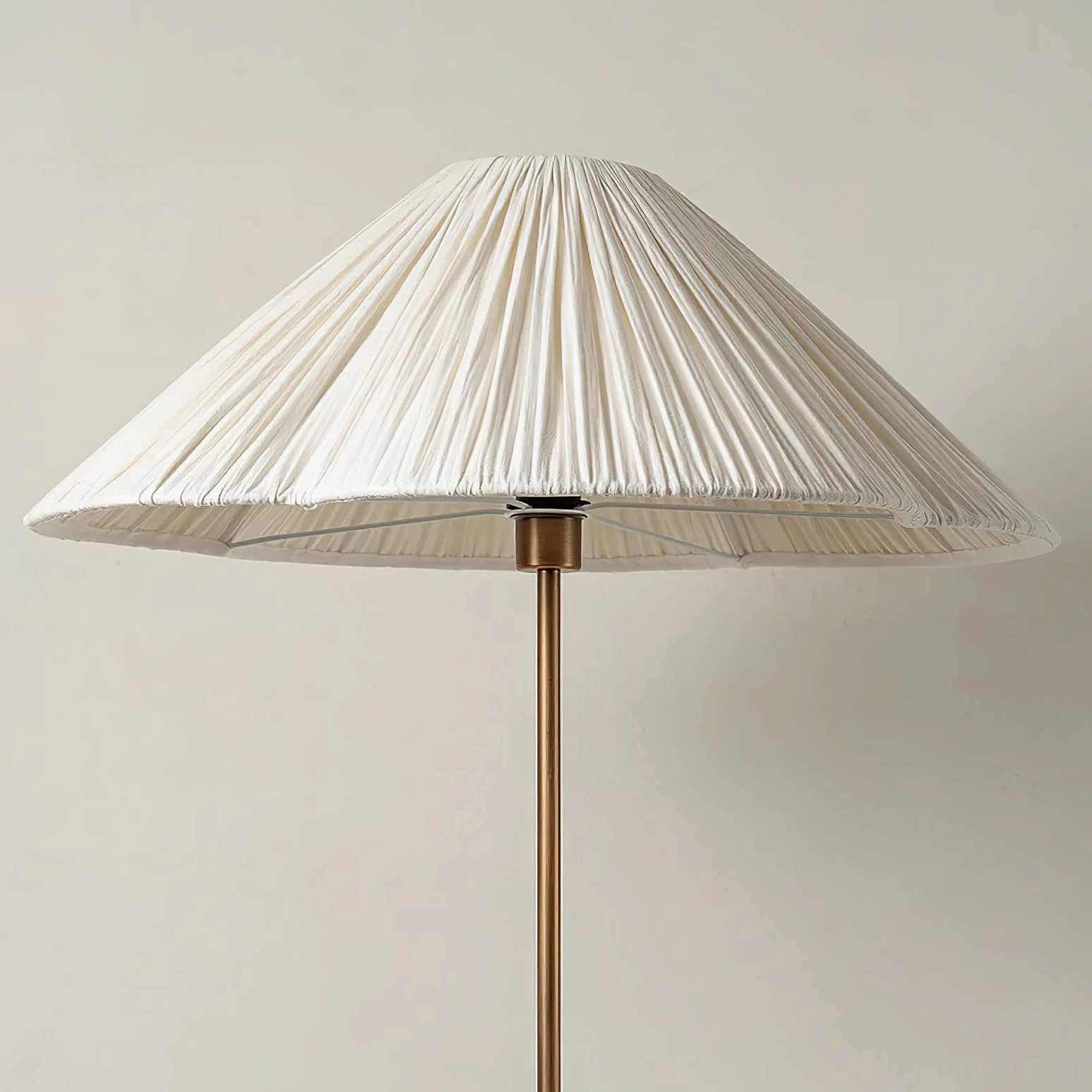 Close-up detail of Sierra lamp shade, front view, highlighting the crisp knife-pleated linen texture and conical umbrella form with metal fixture