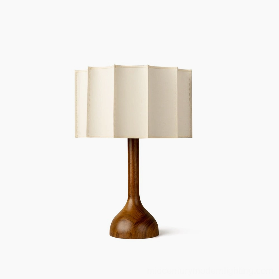 Sierra mid-century modern table lamp with solid walnut turned wooden base and pleated beige fabric shade, studio front view