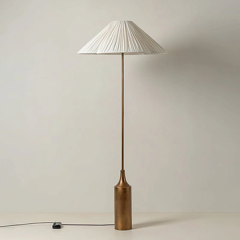 Sierra mid-century modern floor lamp, direct front view, displaying the sculptural proportions of the knife-pleated white linen shade and matte gold cast metal pedestal