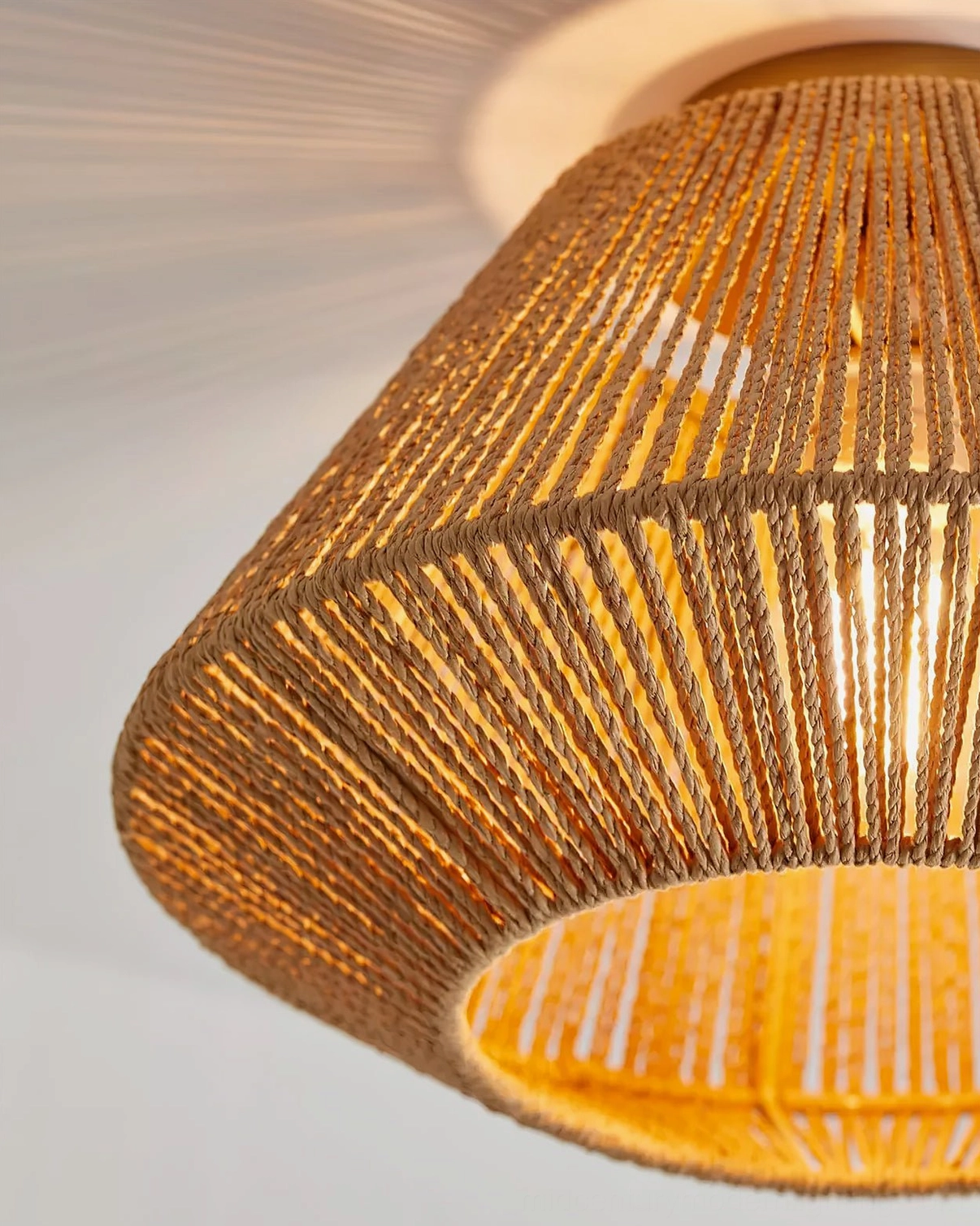 Sierra ceiling light interior structure showing warm glowing light through woven rattan gaps