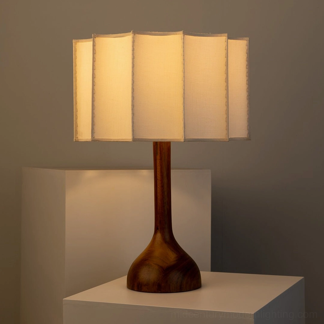 Sierra mid-century modern table lamp with pleated beige fabric shade creating warm diffused ambient lighting