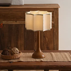 Sierra wooden table lamp styled on vintage dining table with warm interior ambiance and rustic home décor