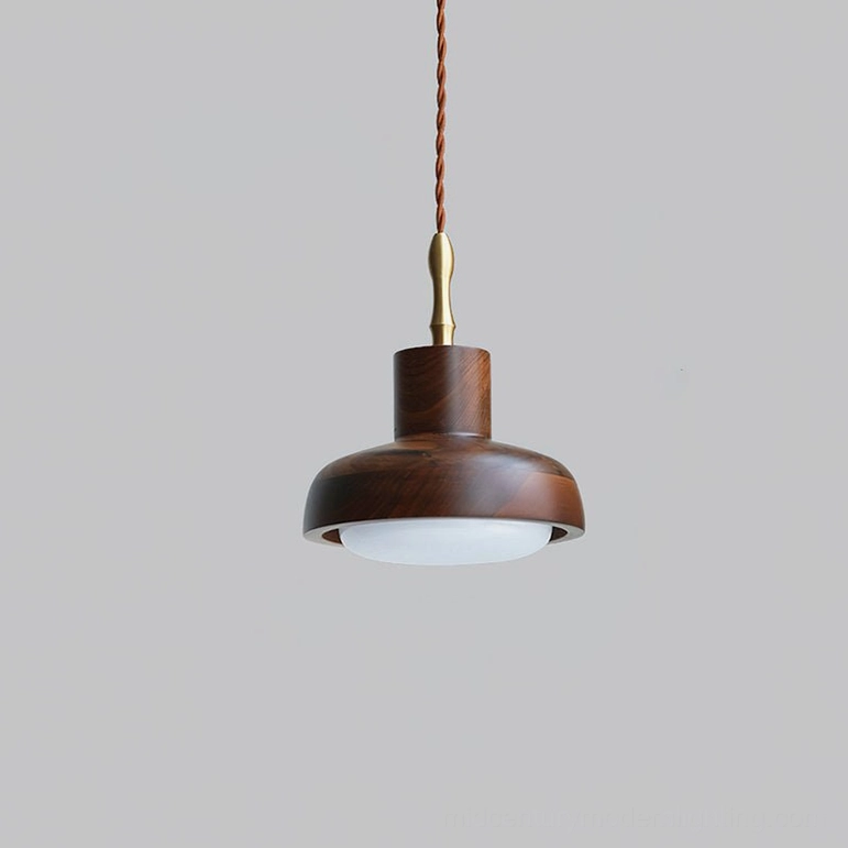 Silas walnut and brass pendant light overhead front view on light gray background, twisted cord and frosted wood finish visible