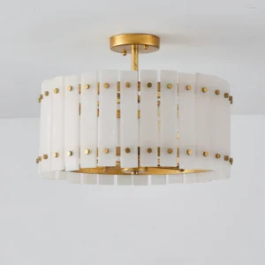 Close-up detail of Sinclair alabaster ceiling light showing brass stud fasteners and vertical slat construction with natural stone texture