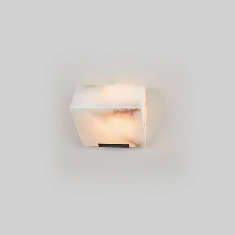 Single-light alabaster wall lamp minimal sculptural design, warm LED light through translucent alabaster stone