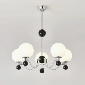 Six-head geometric chrome chandelier featuring polished chrome hardware and black accent spheres, overhead perspective
