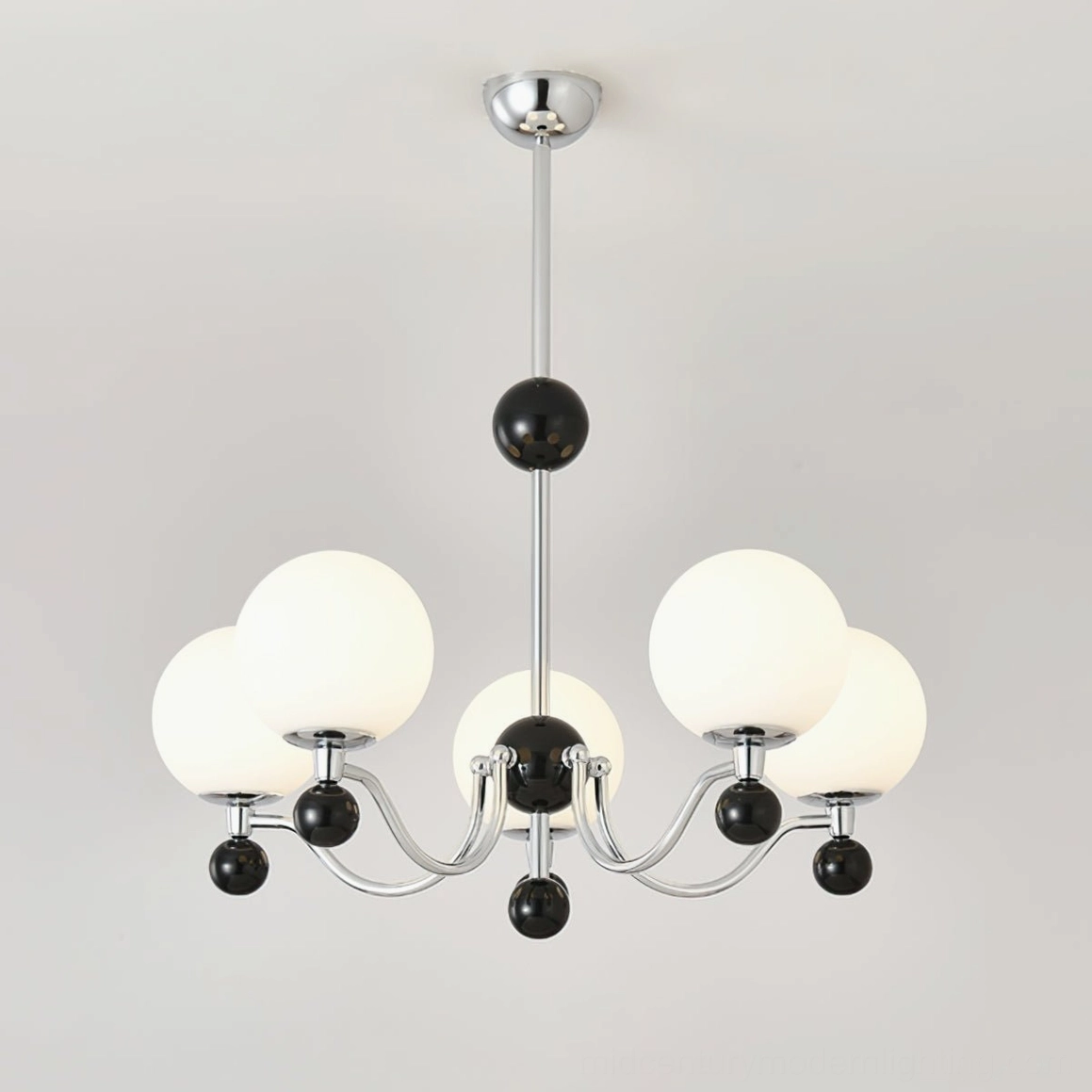 Six-head geometric chrome chandelier featuring polished chrome hardware and black accent spheres, overhead perspective