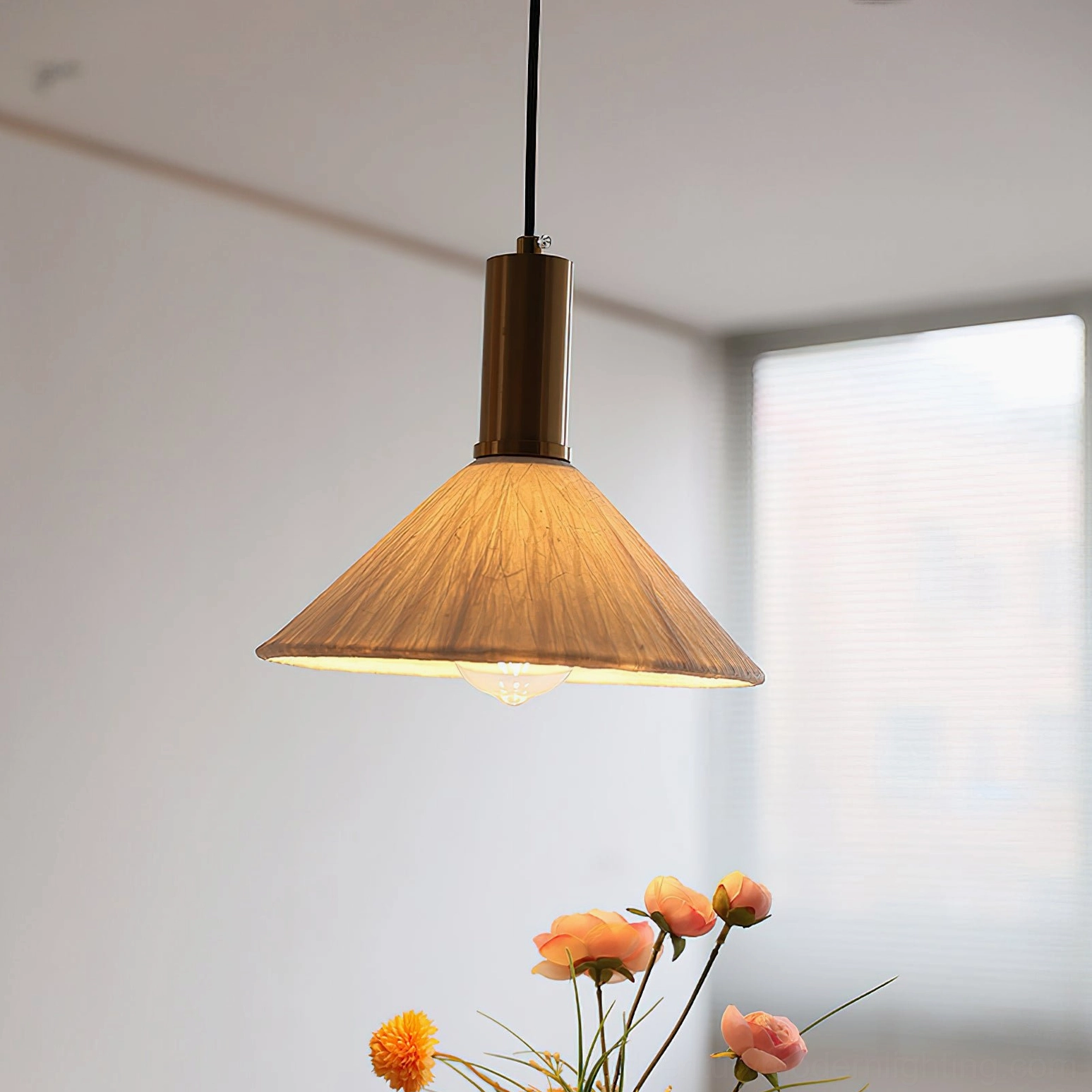 Siya handcrafted paper pendant light with warm crinkled shade front view by window, minimalist boho interior