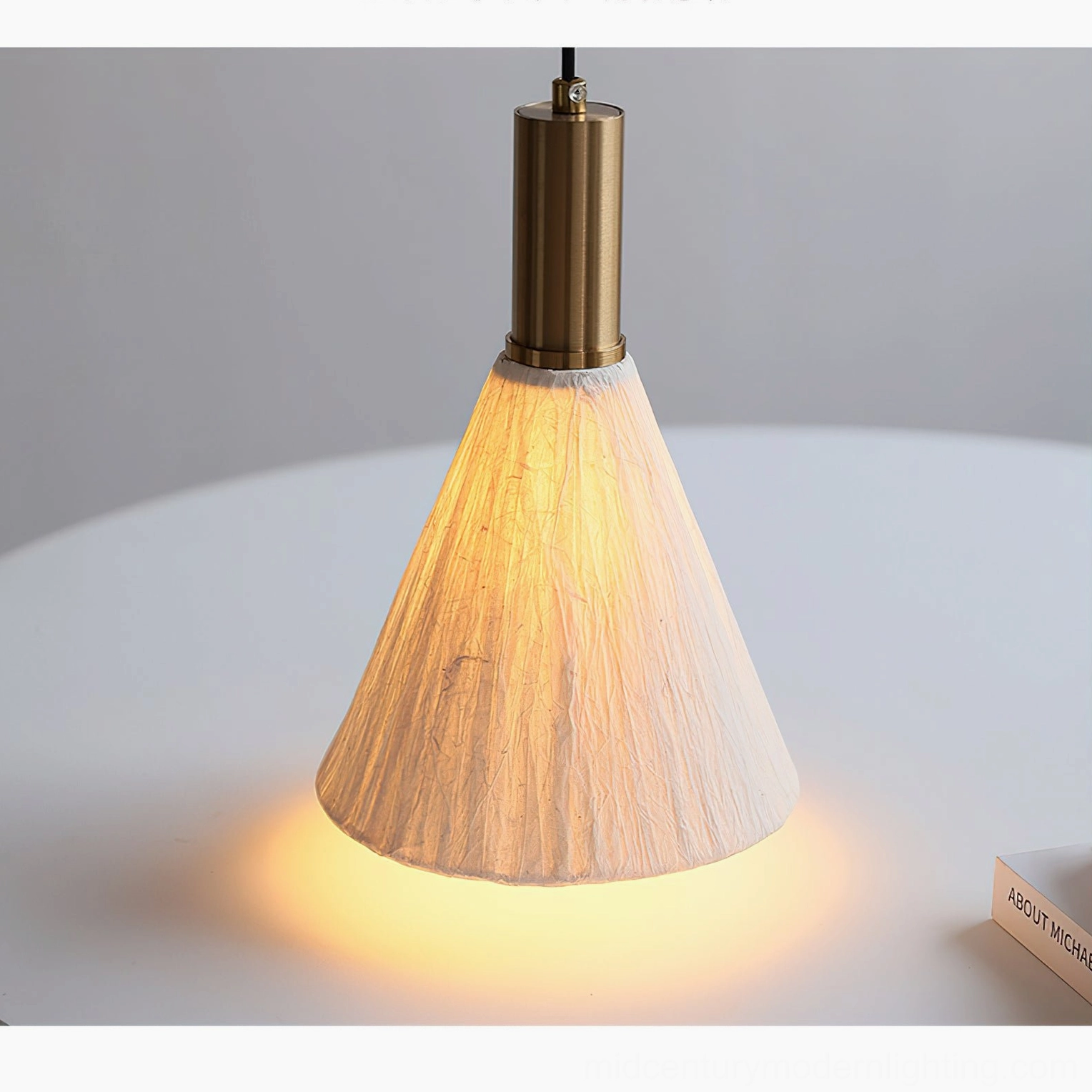 Multiple Siya pendant lights grouped installation creating warm ambient lighting in dining space