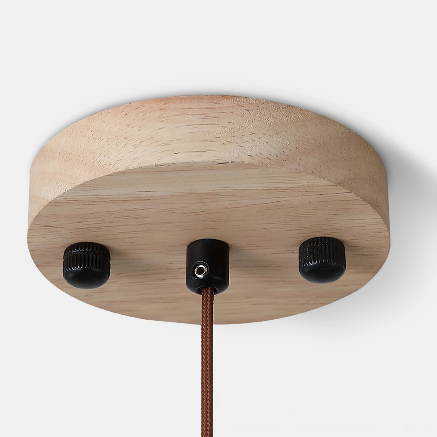 Siyane pendant light architectural photography highlighting travertine disc and wooden connector proportions