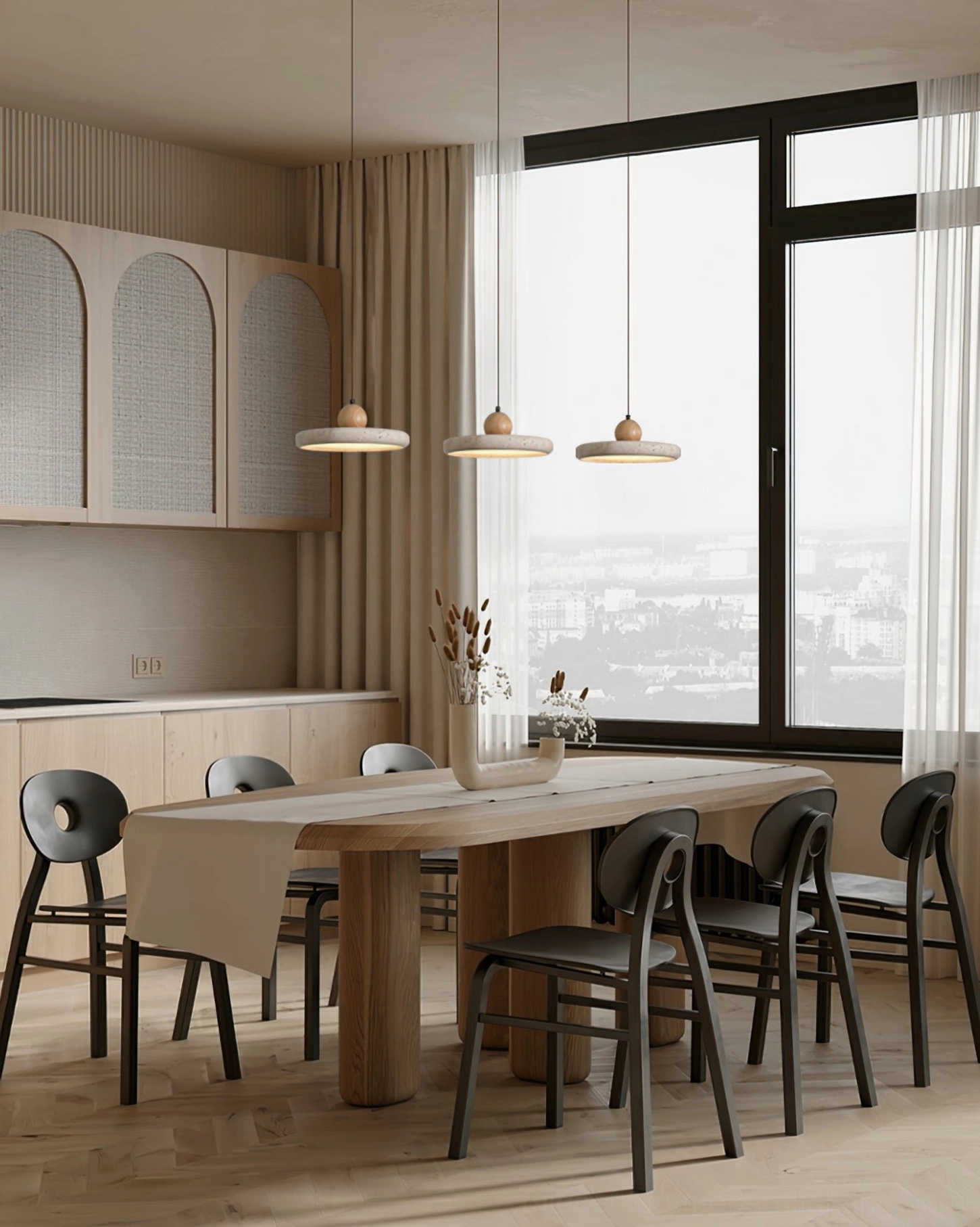 Three matching Siyane travertine pendant lights suspended above kitchen island in open concept home