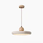 Siyane travertine pendant light with warm LED glow, front view showcasing natural stone disc and wooden connector on white background