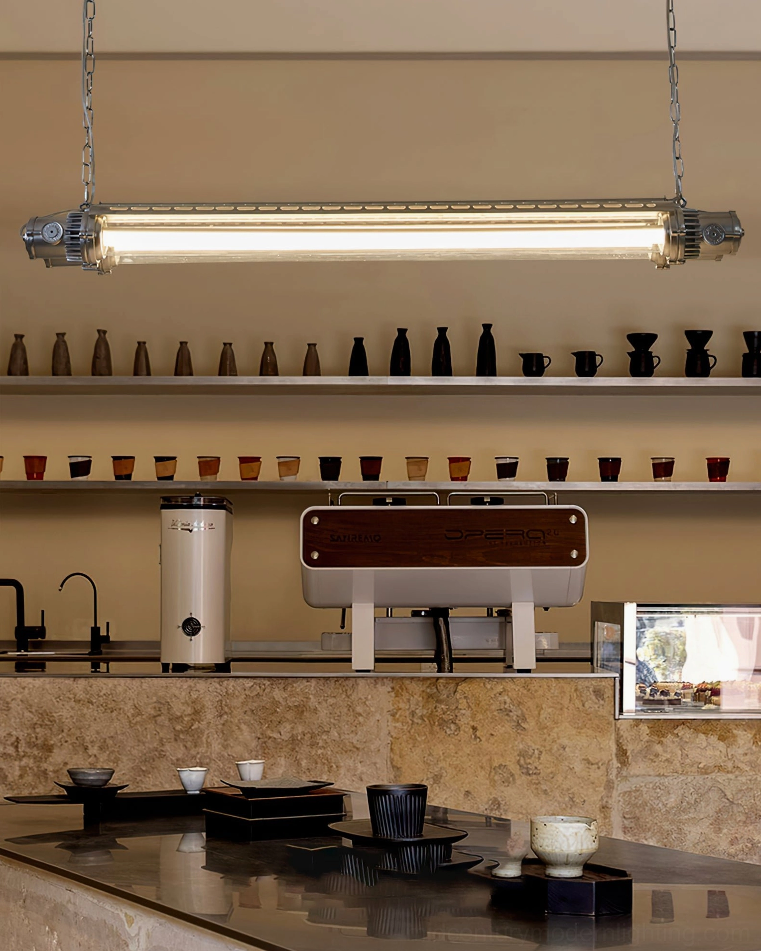 Sleek modern silver tube LED chandelier in Japanese style cafe counter, minimalist industrial decor