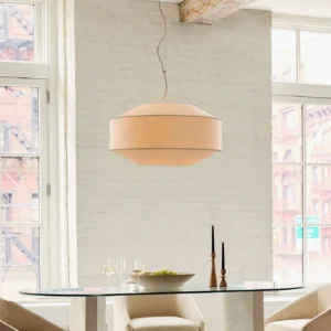 Sloane pendant light in industrial dining room with exposed brick and warm ambient lighting