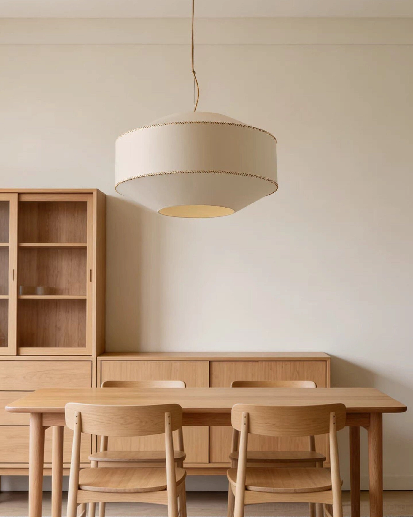 Contemporary fabric pendant light in modern wooden dining room with natural warm aesthetic