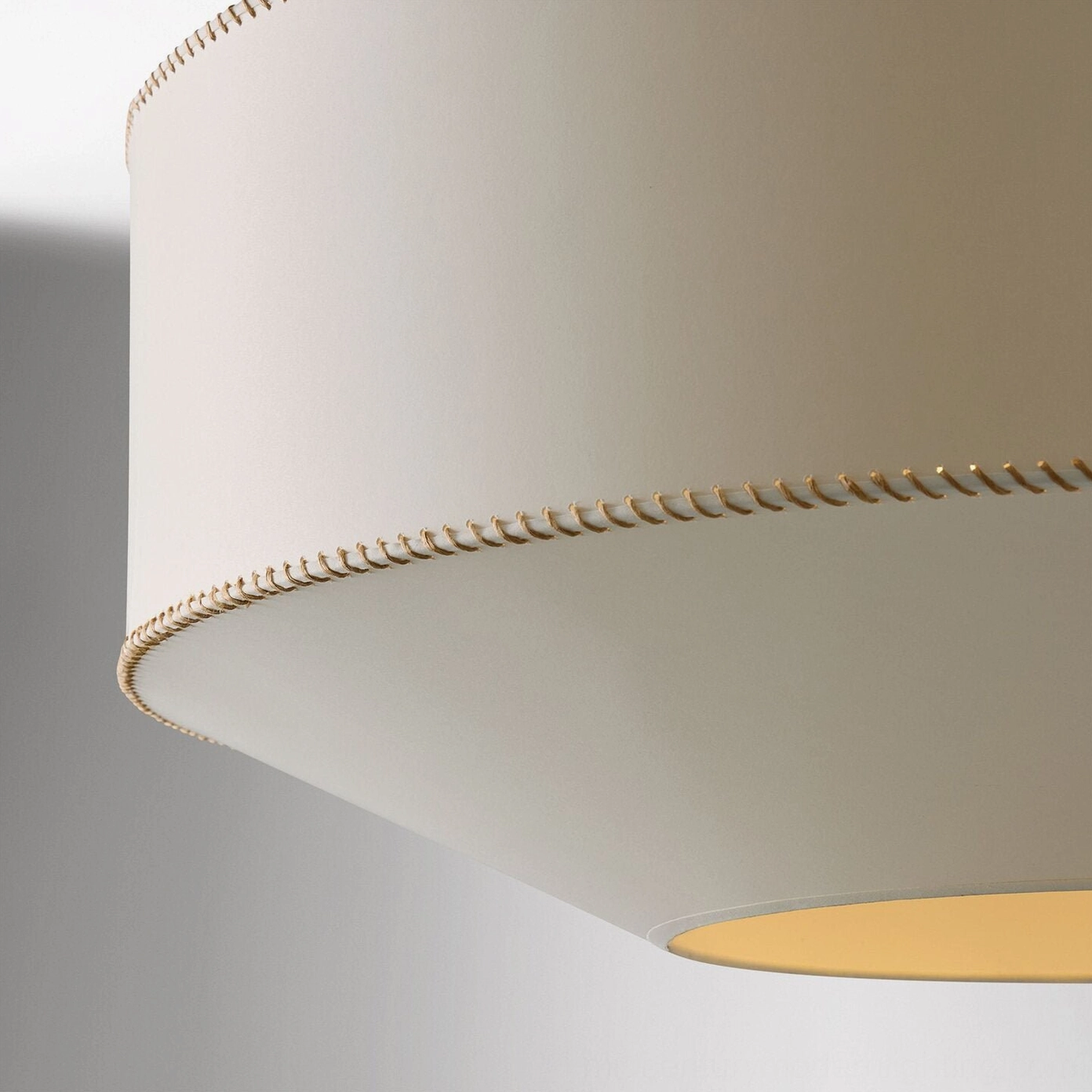 Decorative whipstitch topstitching detail on warm linen fabric of mid-century pendant light