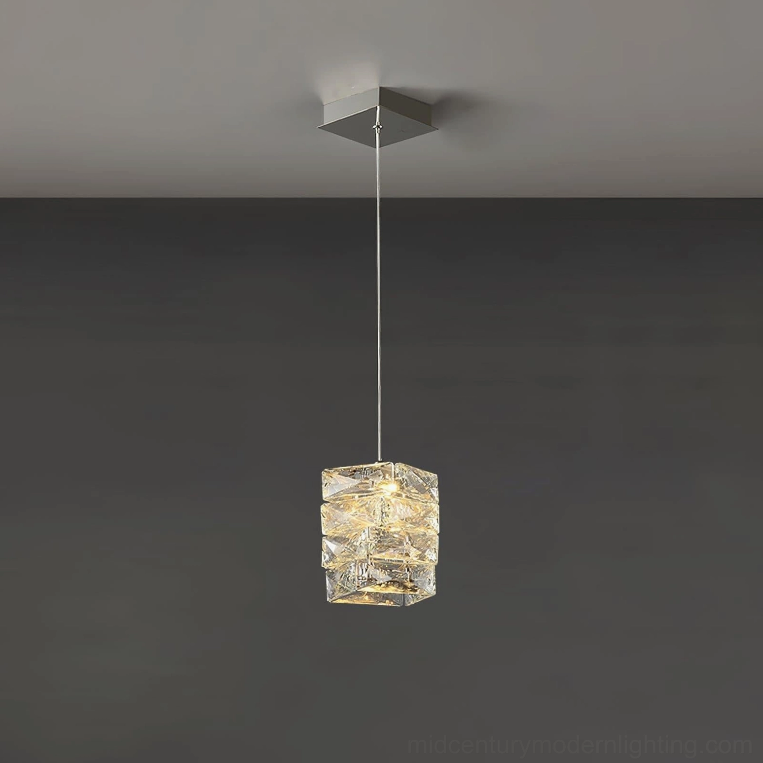 Small-sized faceted crystal pendant lamp showing compact geometric design and integrated LED brightness