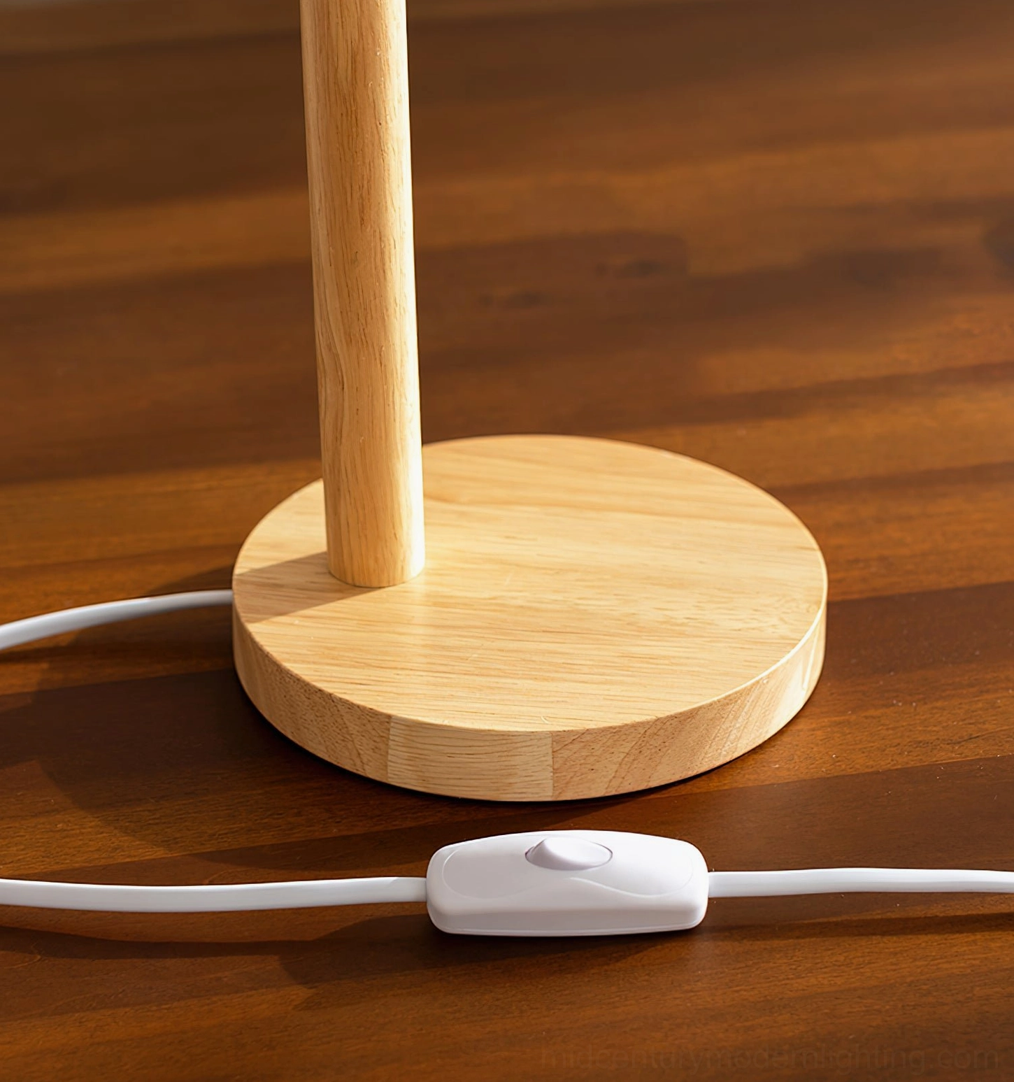 Compact Nordic table lamp with soft warm illumination from low front angle on small desktop