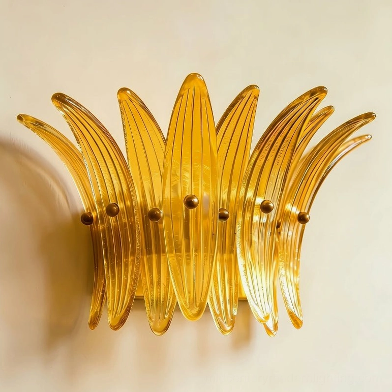 Smeralda wall sconce amber and gold finish mounted on interior wall with styling