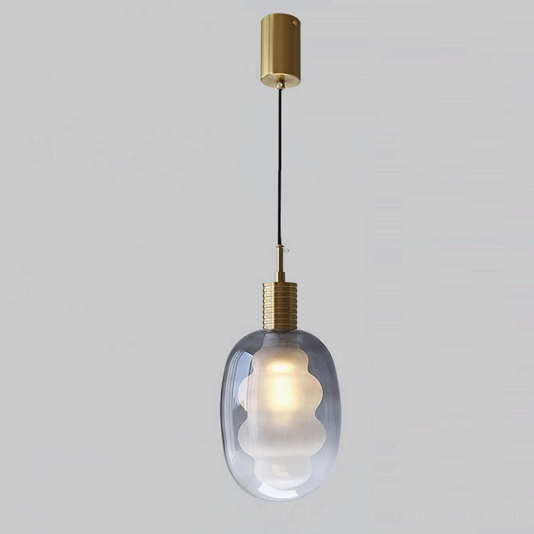 Smoky gray and gold pendant light variant, gradient glass with brass metal top, studio view