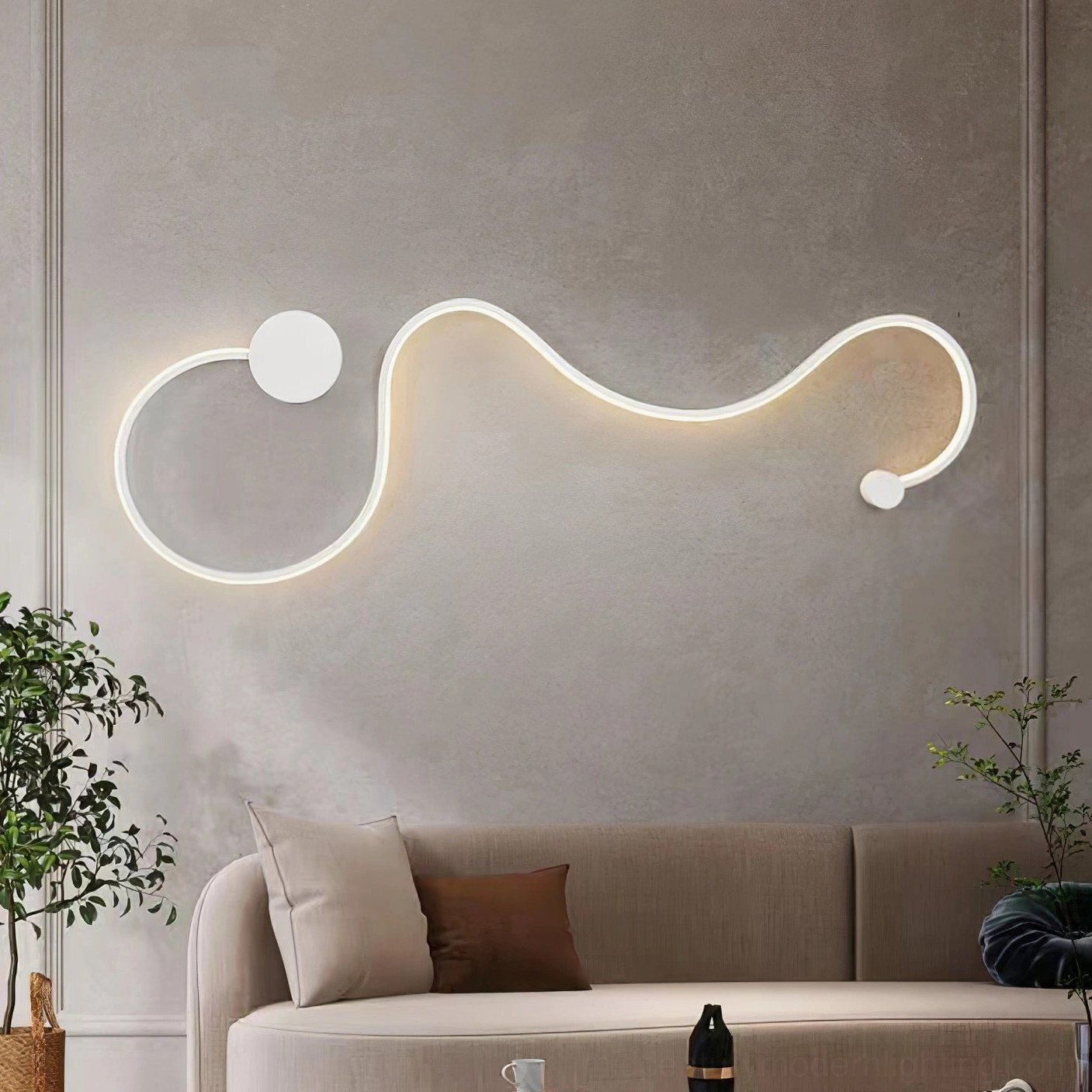 Sculptural snake wall sconce in living room creating artistic focal point above seating