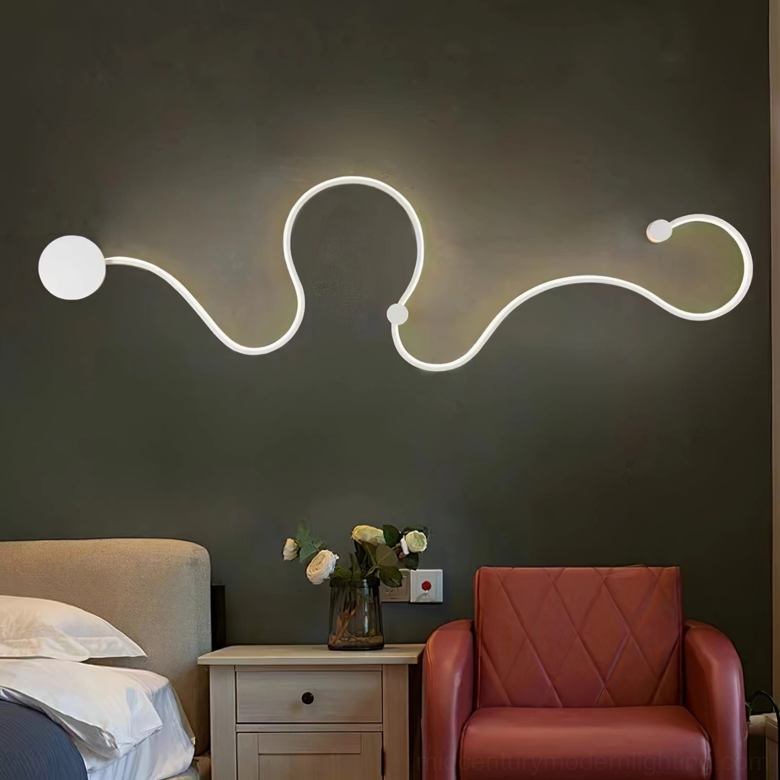 Matte black snake wall sconce finish detail showing modern contemporary aesthetic