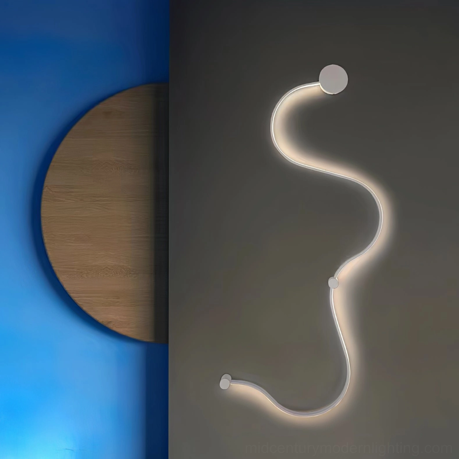 Sculptural snake wall sconce mounted in modern home showing minimalist aesthetic and LED efficiency