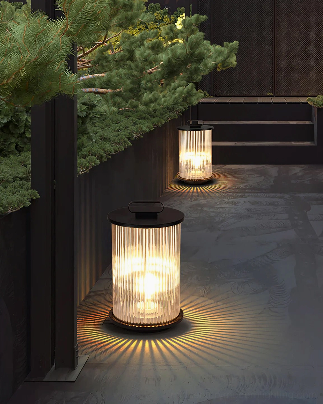 Solar lantern table lamp casting radial warm light patterns on concrete courtyard pathway