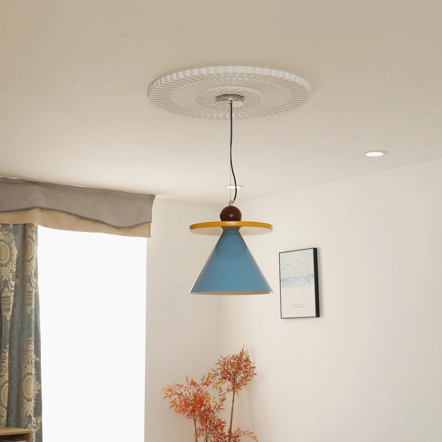 Solid blue cone pendant lamp front-facing view installed on residential ceiling with contemporary lighting setup