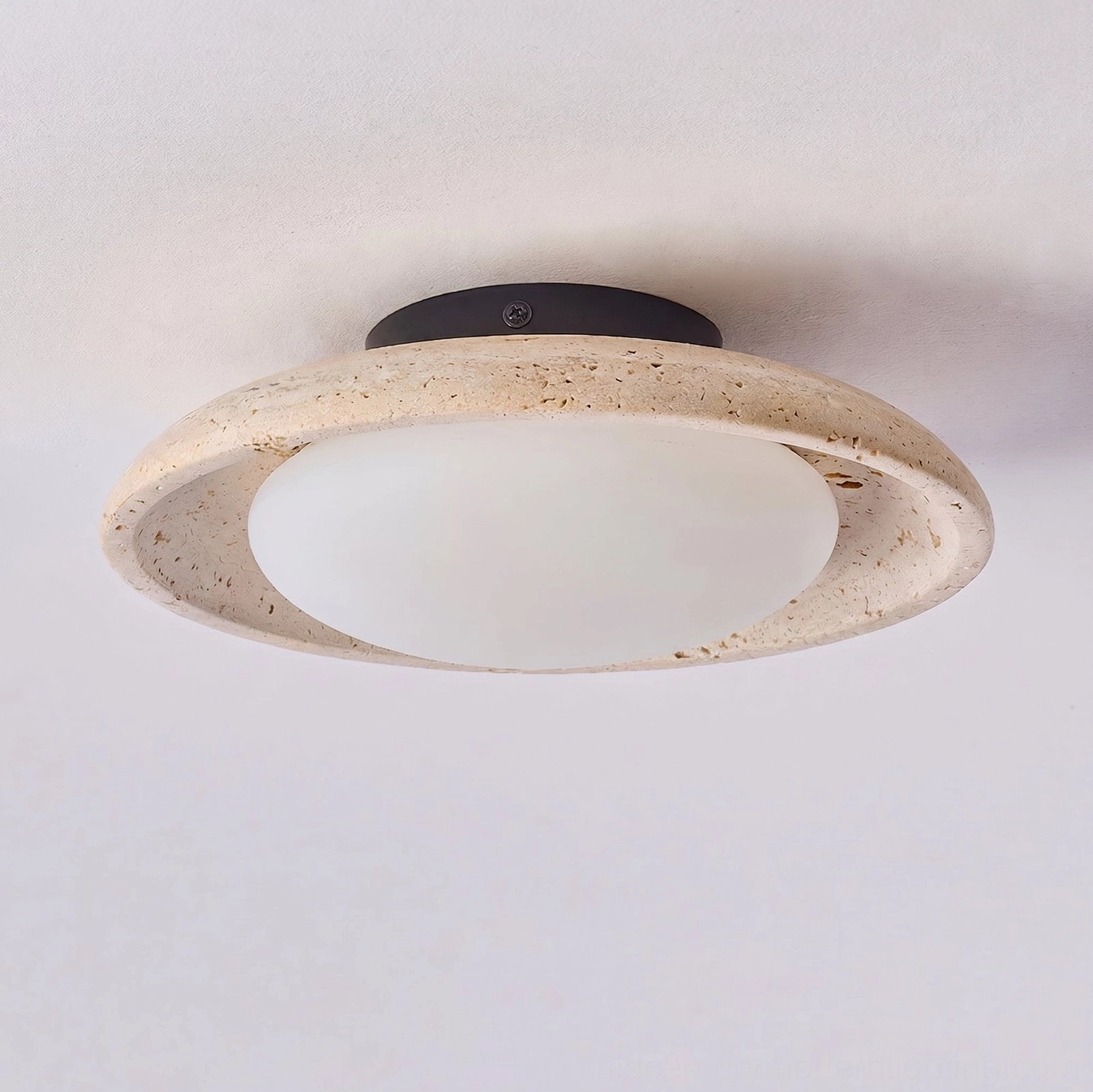 Solis Travertine Ceiling Mount artistic detail view travertine stone porous surface natural veining texture contemporary lighting