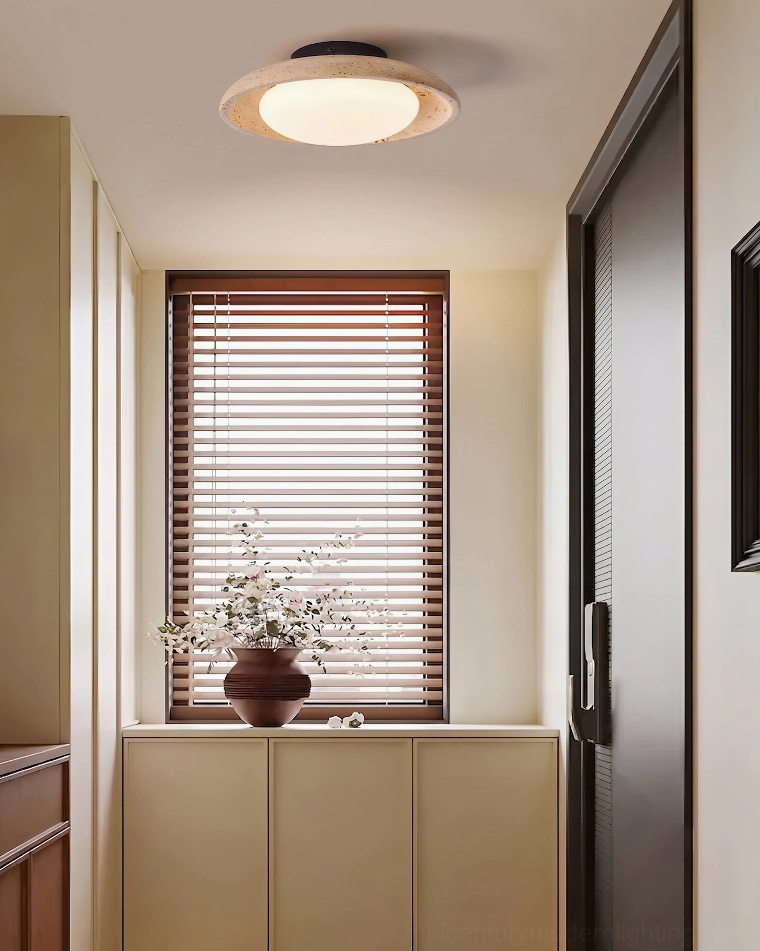 Solis Travertine Ceiling Mount in entryway hallway overhead view with window blinds and wooden storage cabinet warm neutral decor